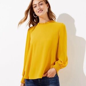 LOFT sheer mustard yellow blouse with ruffled neck and tie in back